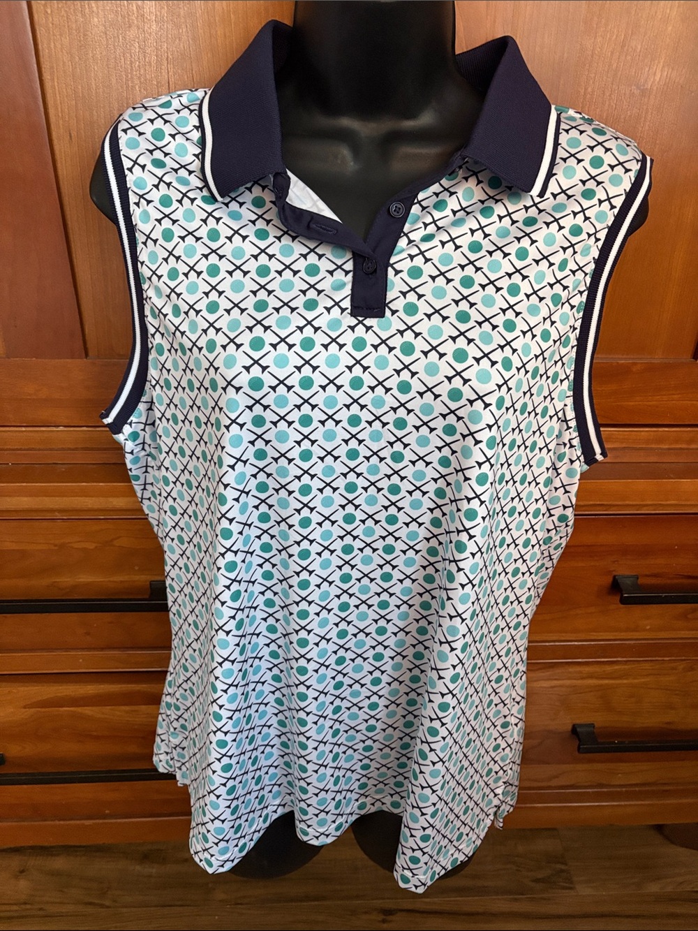 Lillie Green Sleeveless Polo Top with Navy Trim and golf tee  Pattern
